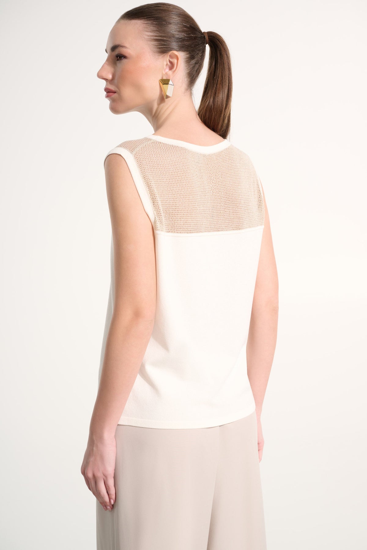 Sleeveless crew neck pullover top by Joseph Ribkoff in a solid fabric, displayed on a neutral background.