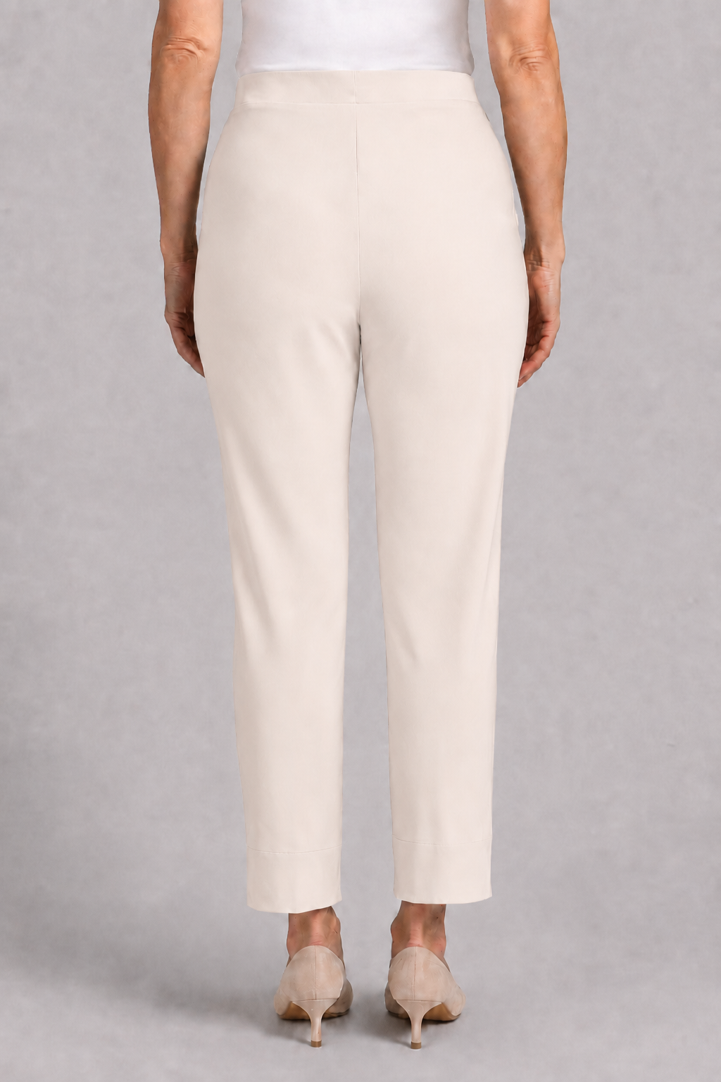 Back view of SYMPLI Hepburn ankle pant in cashew, stylish casual pants with a tailored fit and ankle-length design.