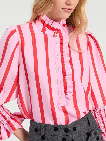 Detail of decorative ruffle high neckline on Vilagallo striped blouse
