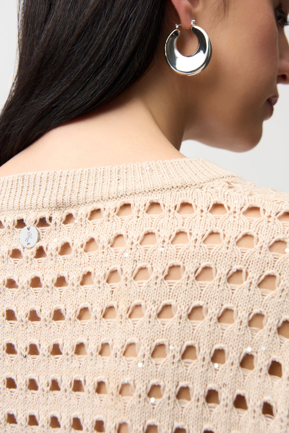 Joseph Ribkoff boxy sweater in soft knit, featuring a relaxed fit and long sleeves, displayed on a hanger.