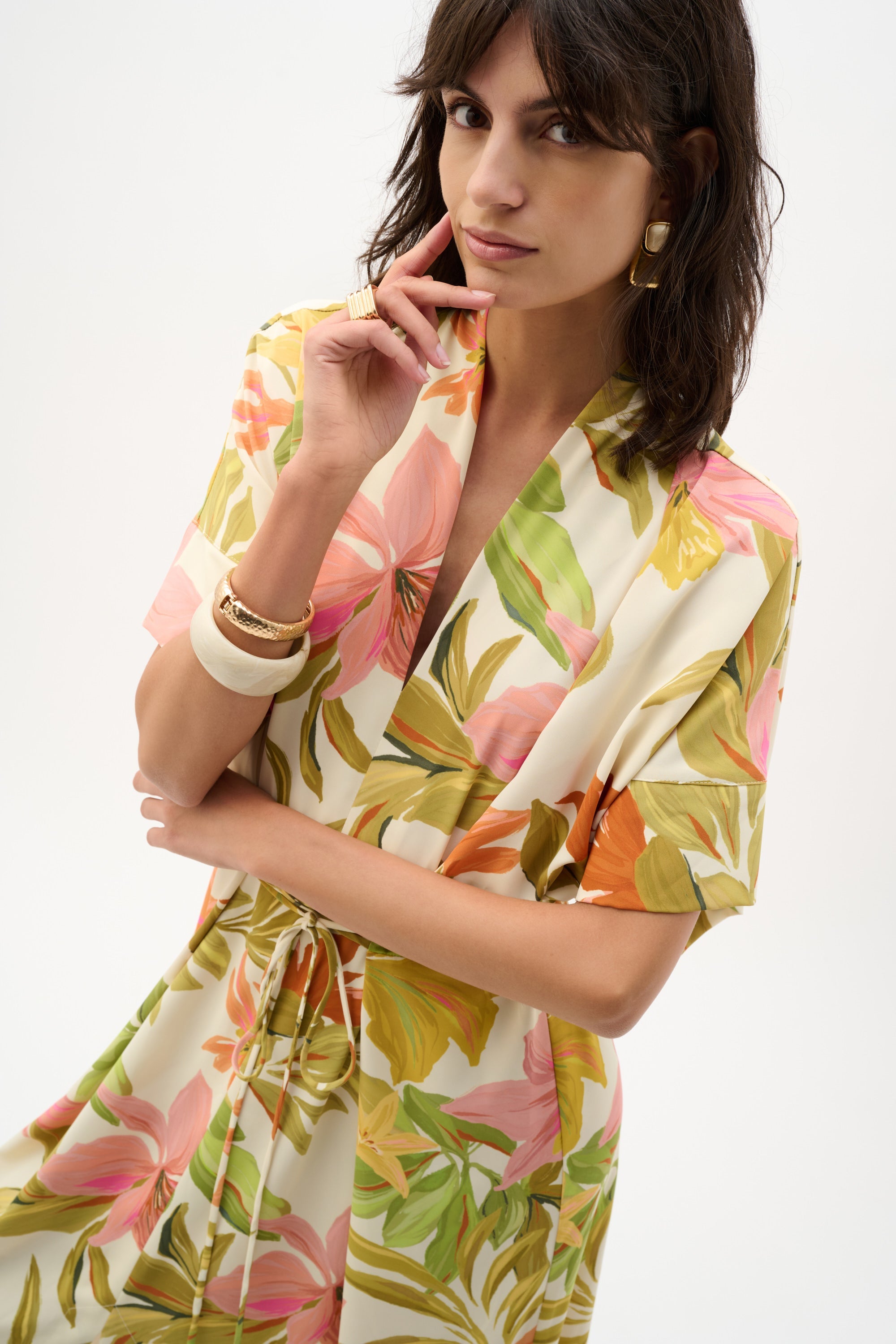 Joseph Ribkoff tropical print dress featuring vibrant floral patterns and a stylish, flowing silhouette.