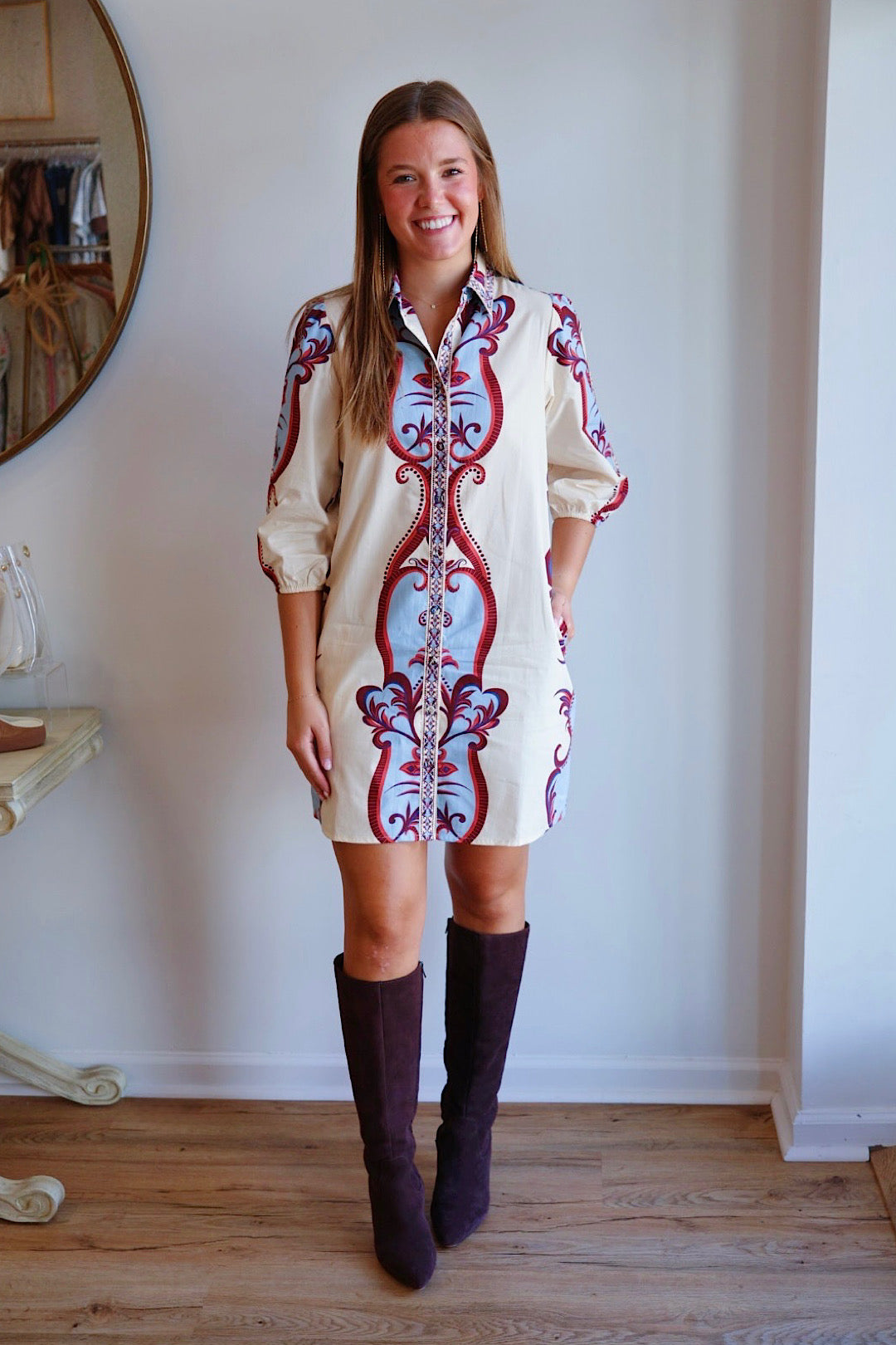 Maude Ava Dress displayed on a hanger, featuring a stylish, casual design in soft fabric with a fitted silhouette.
