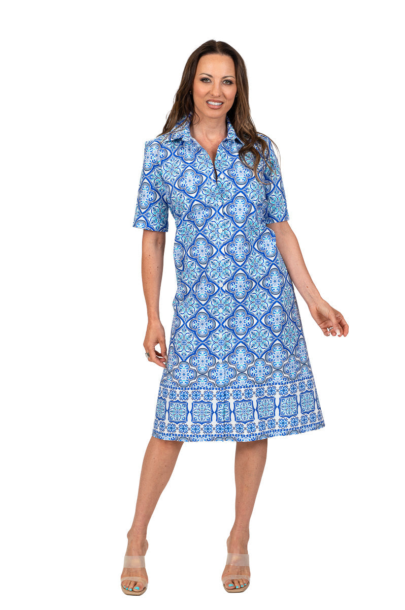 Periwinkle short sleeve dress by SCAPA, lightweight fabric with a flattering fit, displayed on a hanger.