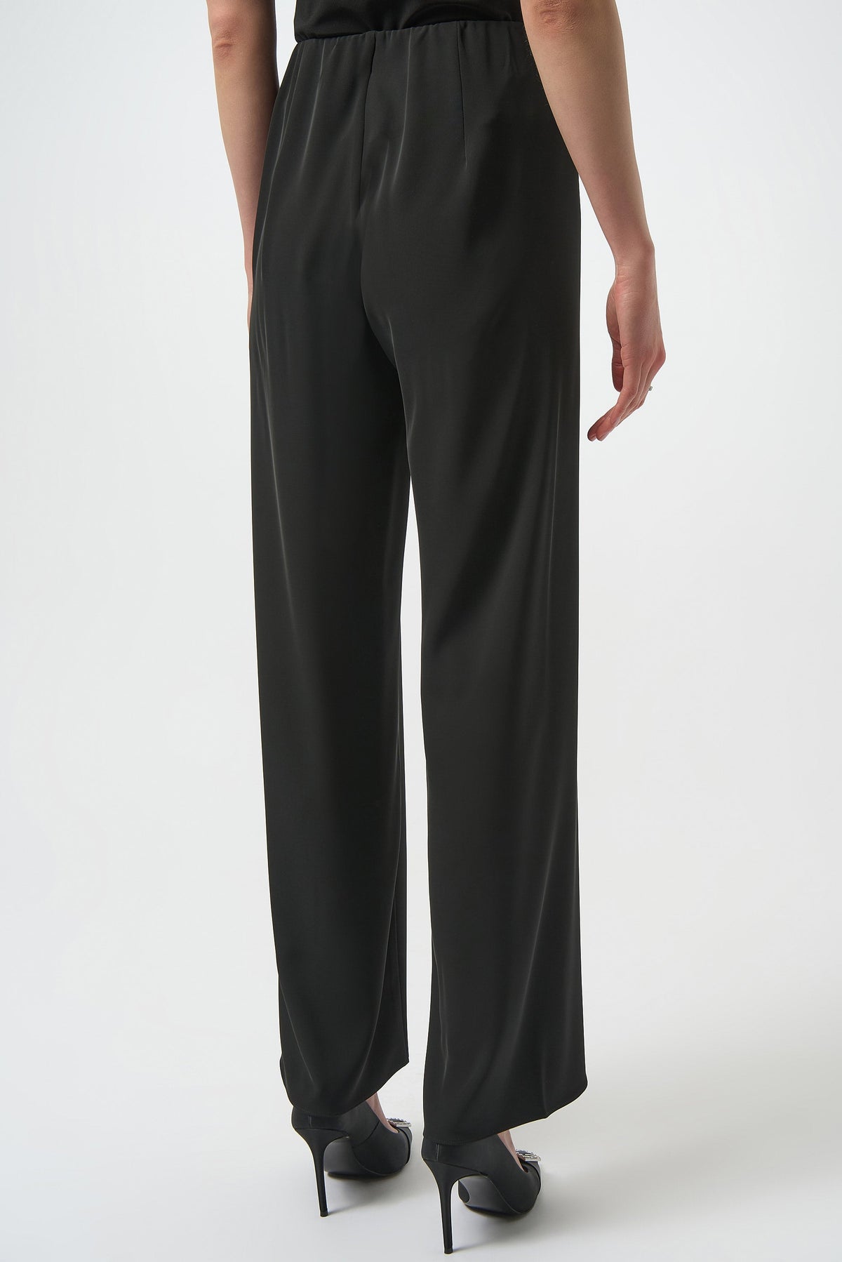 Black Joseph Ribkoff wide leg pull-on pants displayed on a model, showcasing a flowy, comfortable fit and sleek style.