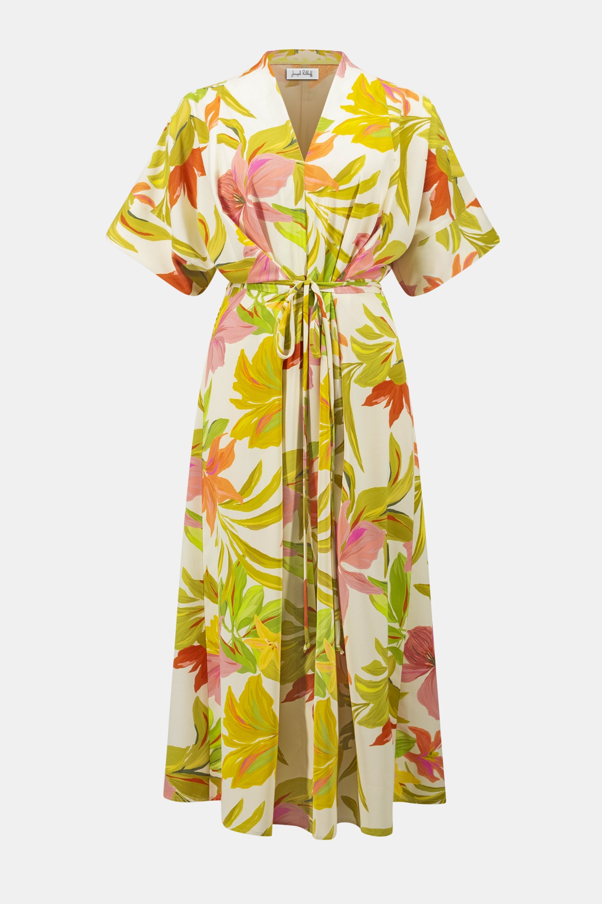 Joseph Ribkoff tropical print dress featuring vibrant floral patterns and flowing fabric, perfect for warm-weather occasions.