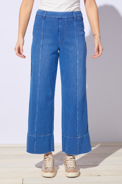 Mid-wash Escape by Habitat denim relaxed leg jeans displayed on a hanger, showcasing casual comfort and classic jean style.
