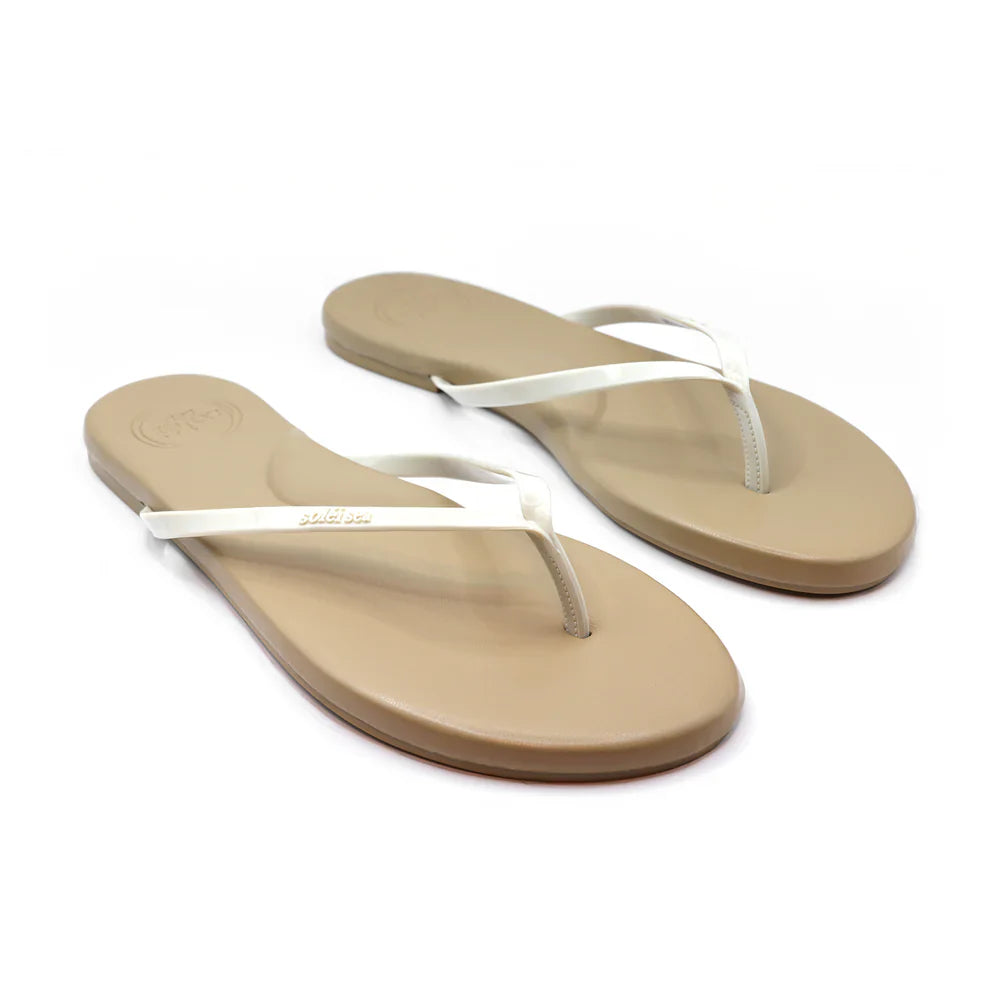 Beige flip-flops with white straps on a white background