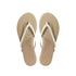 Pair of beige flip-flops with white straps on a white background