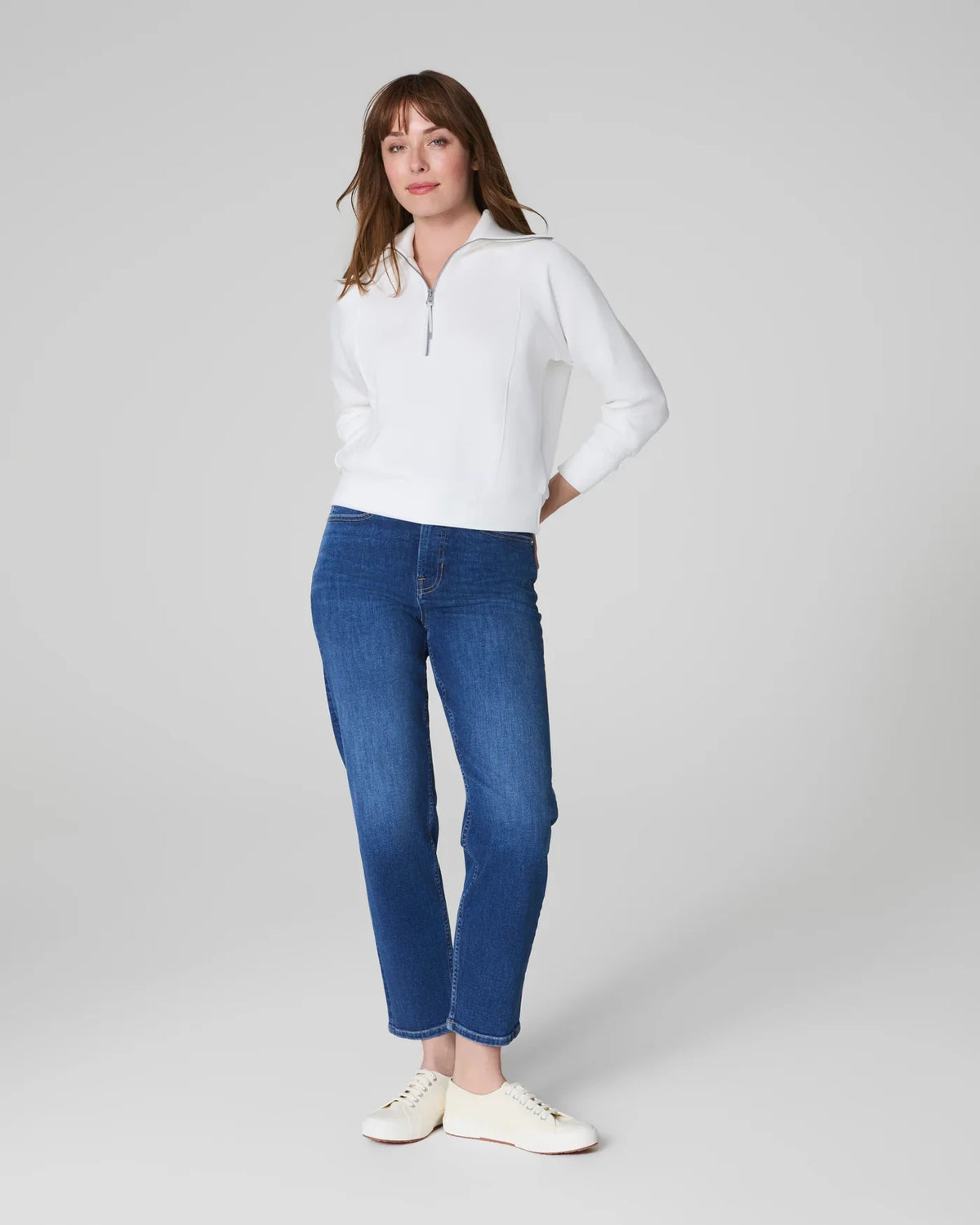 SPANKs Airessentials Half Zip Powder jacket showcased in a sleek, fitted design perfect for activewear and casual outfits.