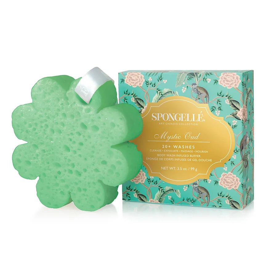 Green flower-shaped sponge with packaging on a white background