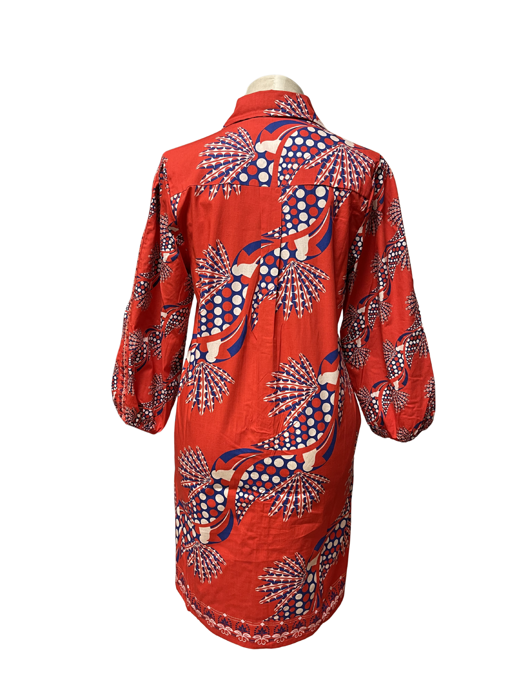 Woman wearing a red patterned dress