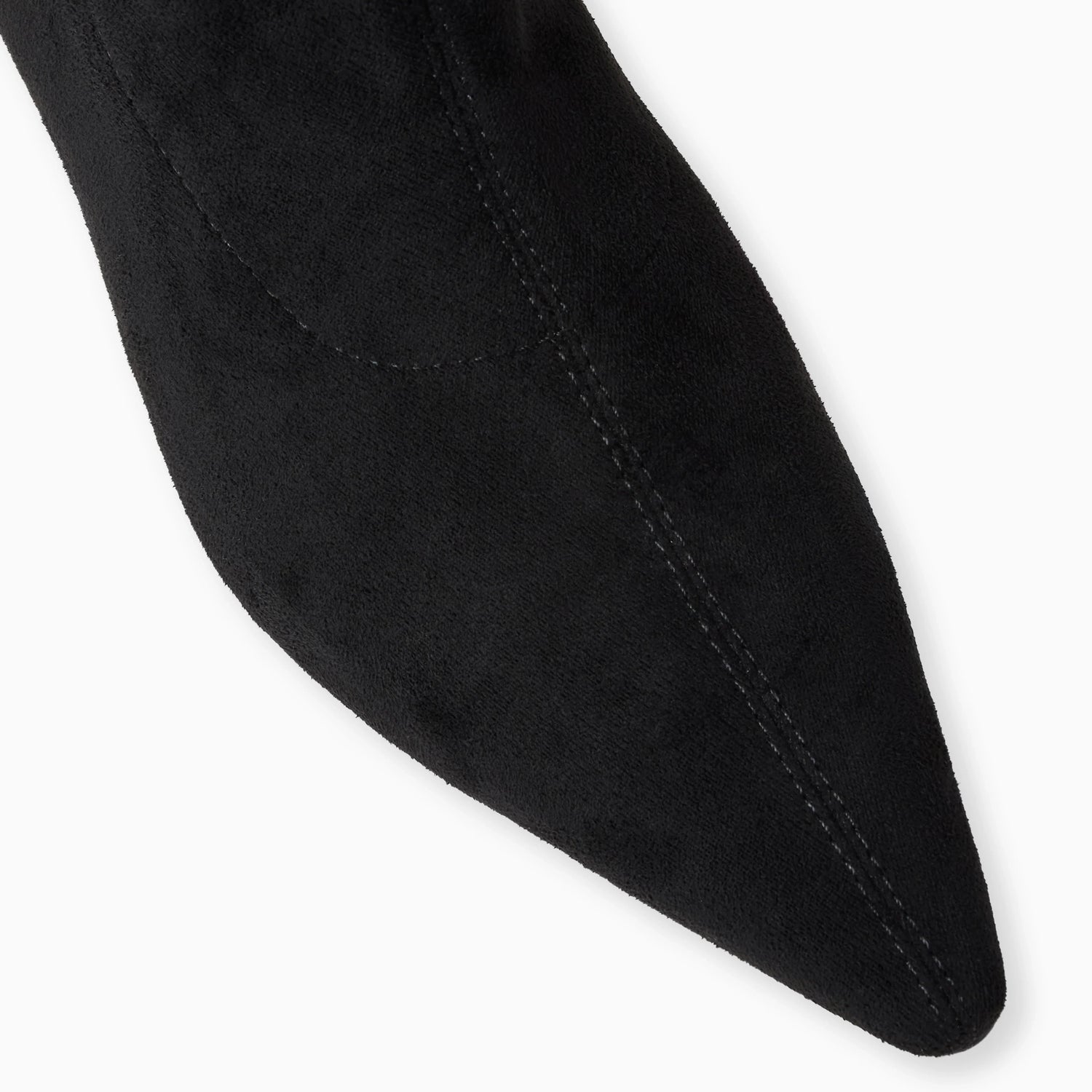 Close-up of a black sock with a pointed toe on a white background