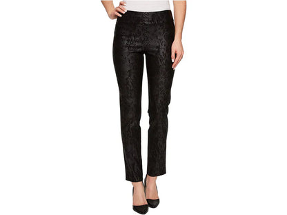 Black snake patterned pants worn by a person on a white background