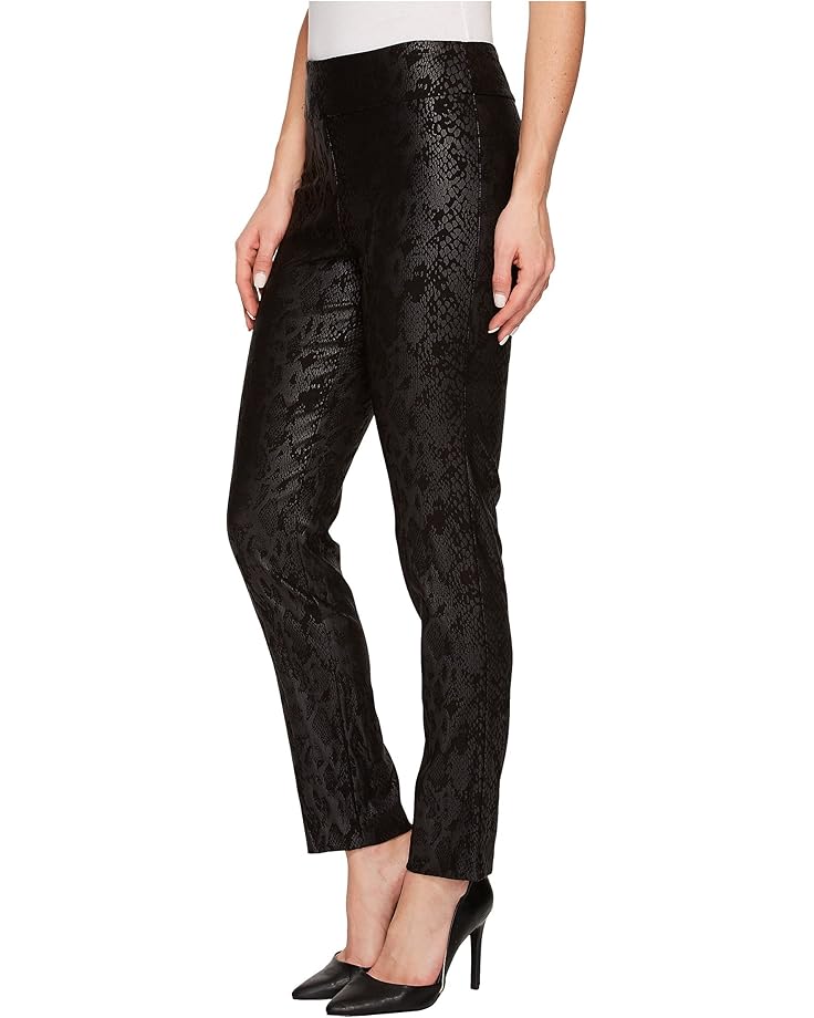 Black snake patterned pants worn by a person on a white background