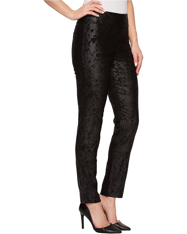 Black snake pants worn by a person on a white background