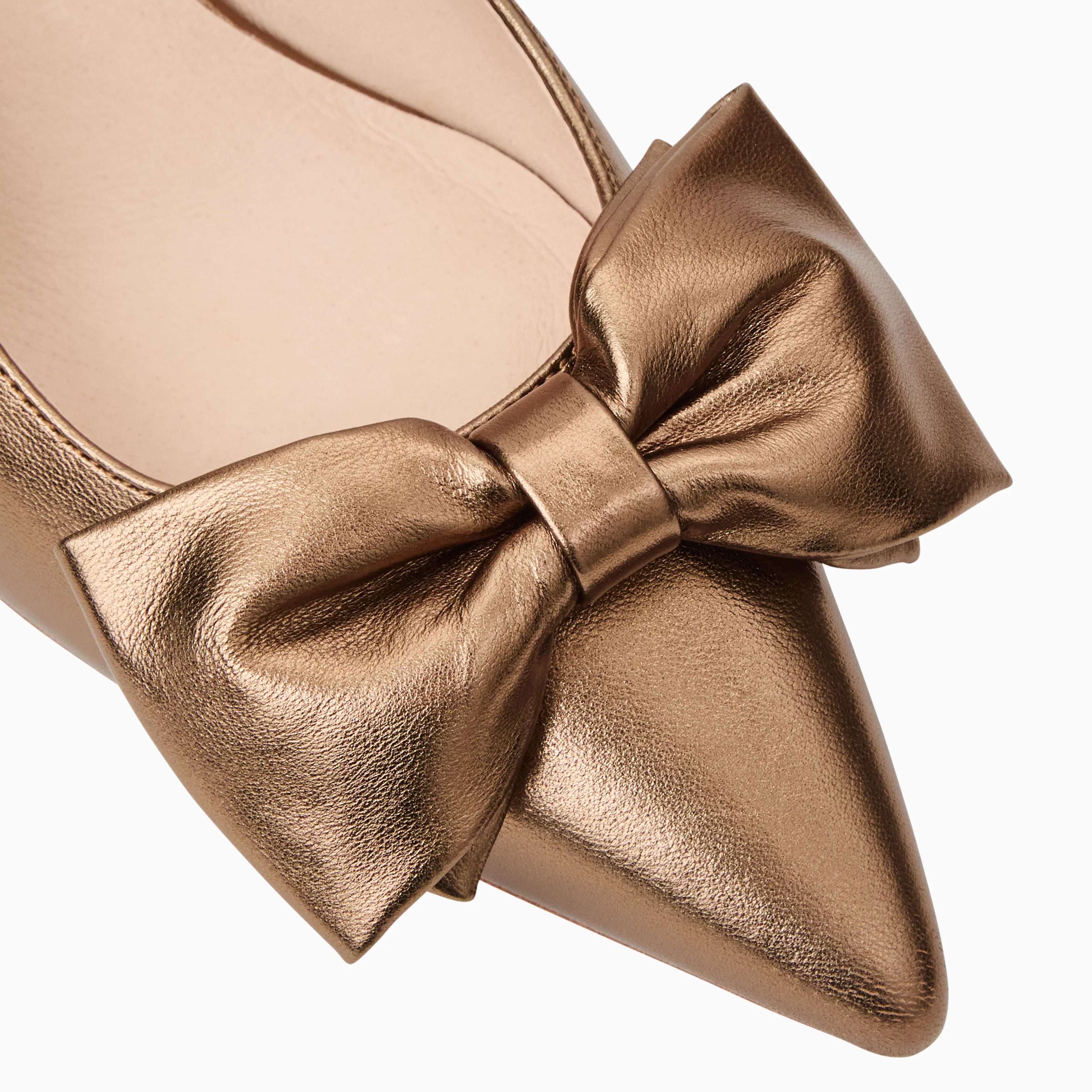 Bronze gold shoe with a large bow on a white background