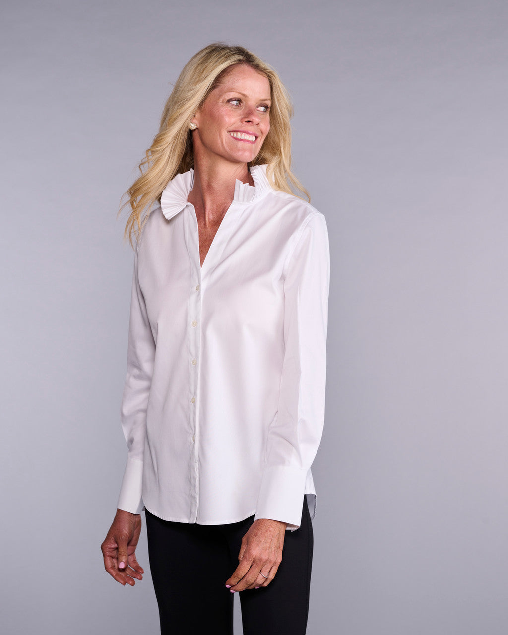 Layered pleated top from CLARIDGE+KING, featuring a stylish design with multiple pleats and a flowing silhouette.