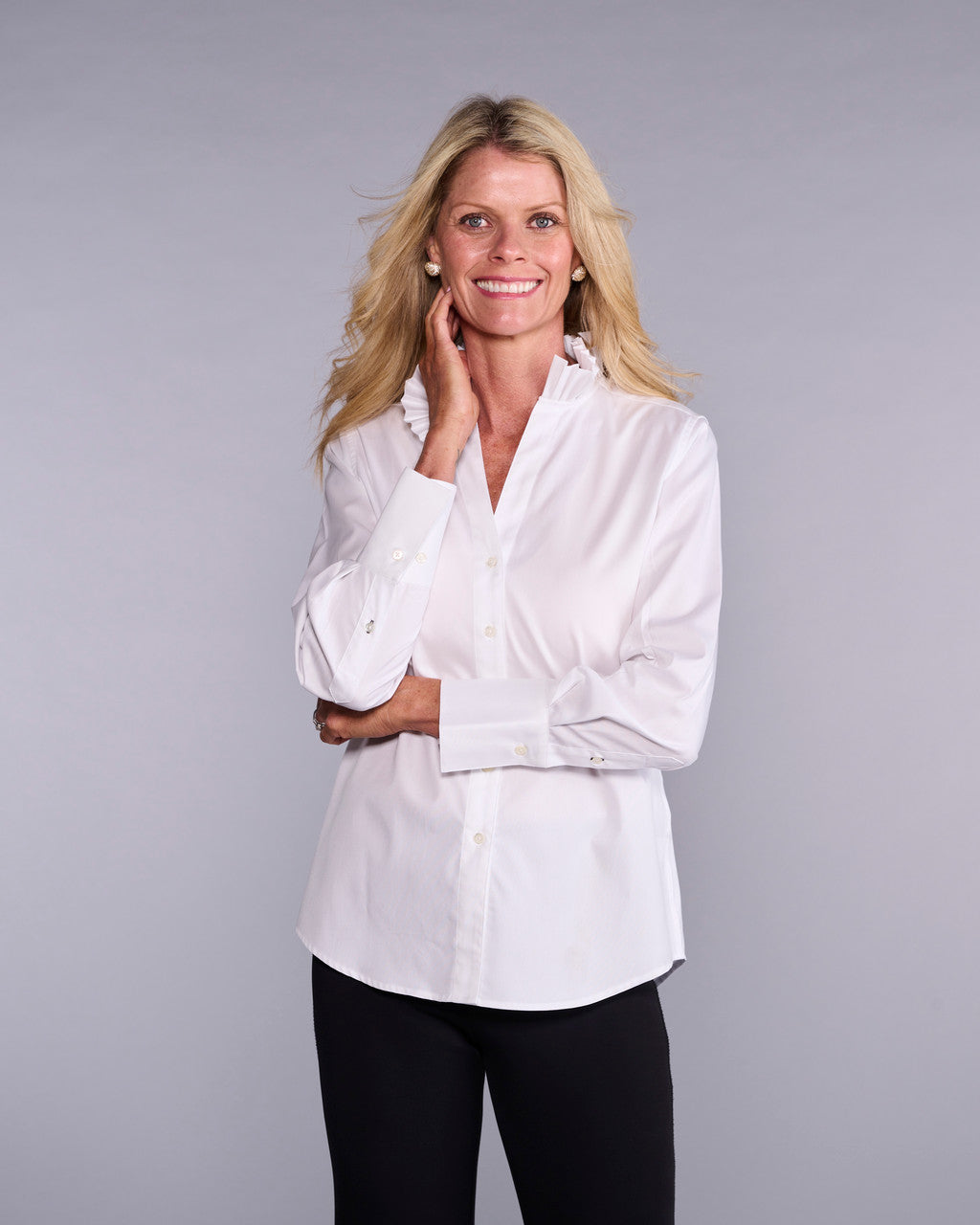 Pleated layered top by CLARIDGE+KING, showcasing a stylish, flowy design with pleats and a layered silhouette.