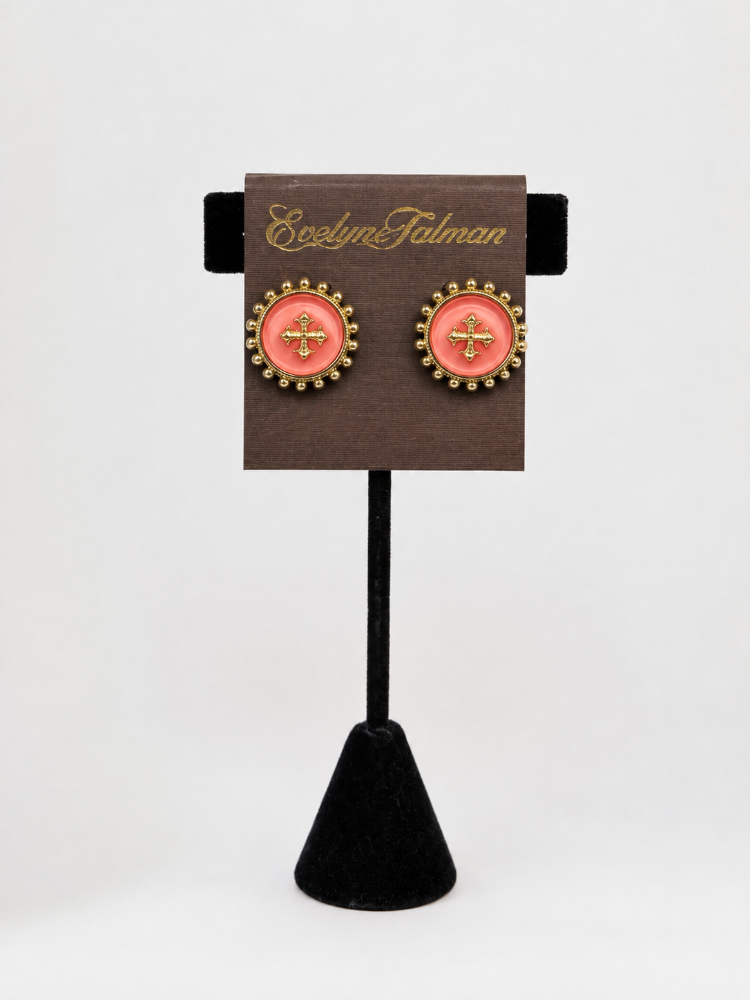 Caroline Hill Kempsey Coin Stud Earring Coral pair of oval stud earrings with coral pink centers, gold floral motifs, and gold beaded borders