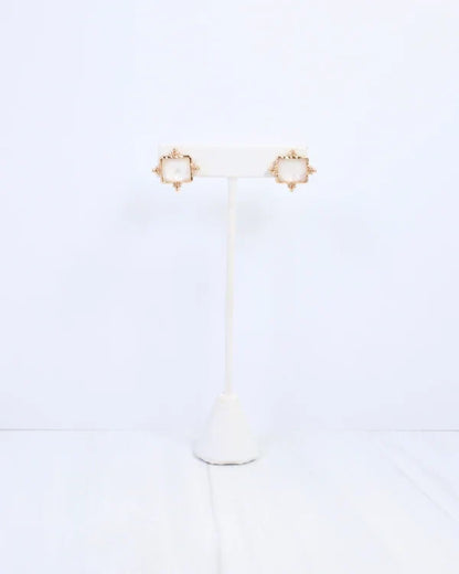Caroline hill Kerang Square Facited Stud Earring White a pair of gold-tone stud earrings with square white mother-of-pearl centers.