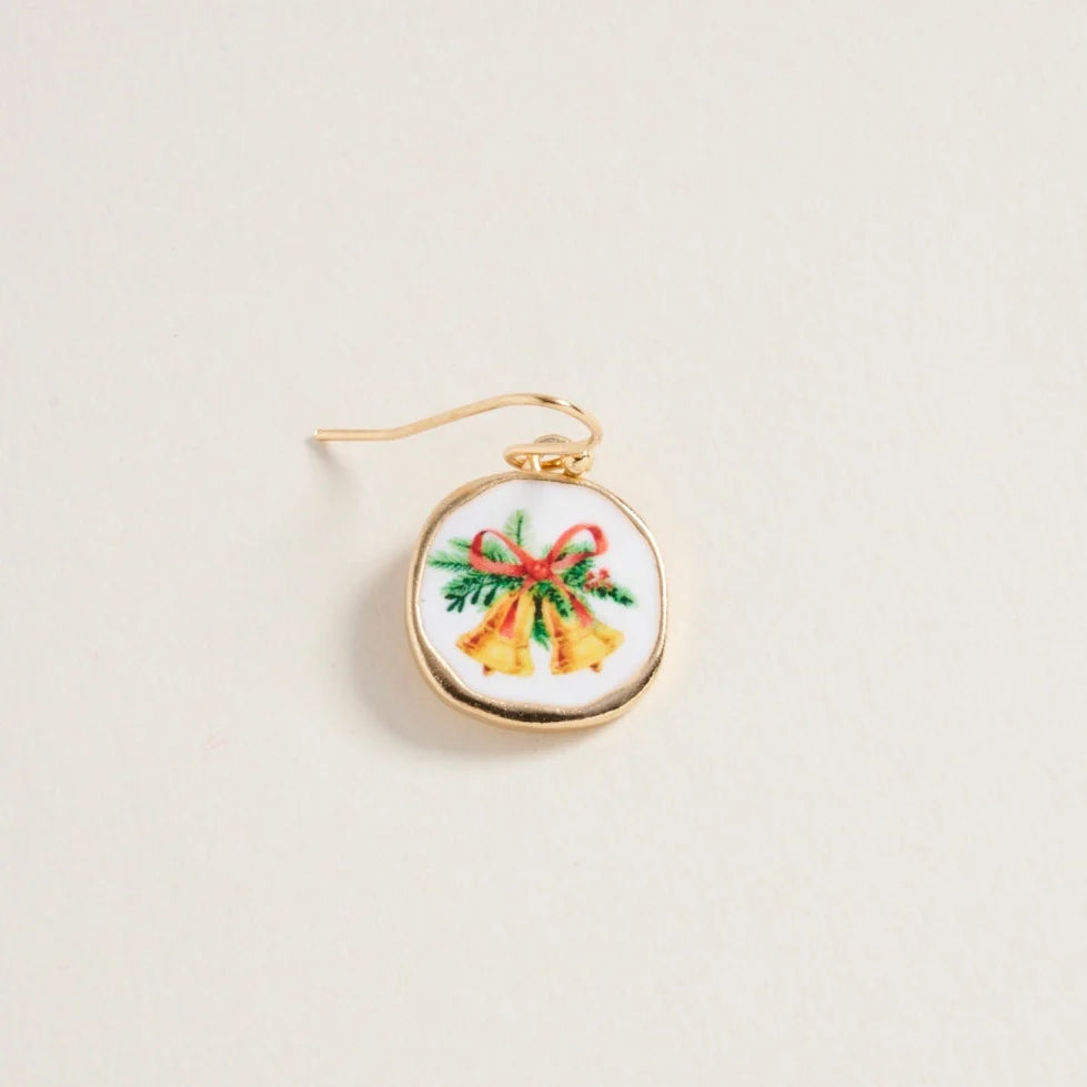 Embroidered earring with Christmas design on a beige background