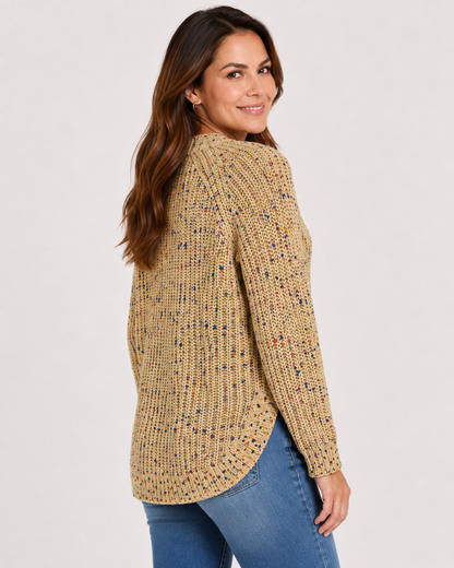 A woman wearing a textured, long-sleeve knit sweater in a beige and yellow heathered pattern with small multicolor flecks, Confetti Side Button Sweater