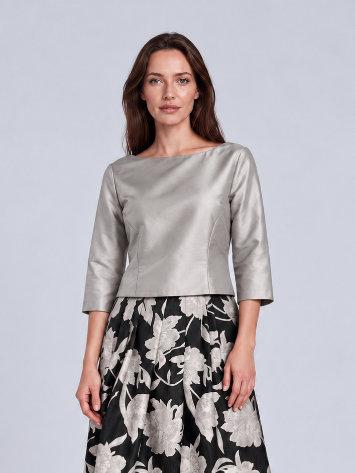 A woman modeling a two-piece outfit consisting of a metallic silver three-quarter sleeve top and a black maxi skirt with a large white floral pattern, Connie Roberson Jennifer Amazon Top