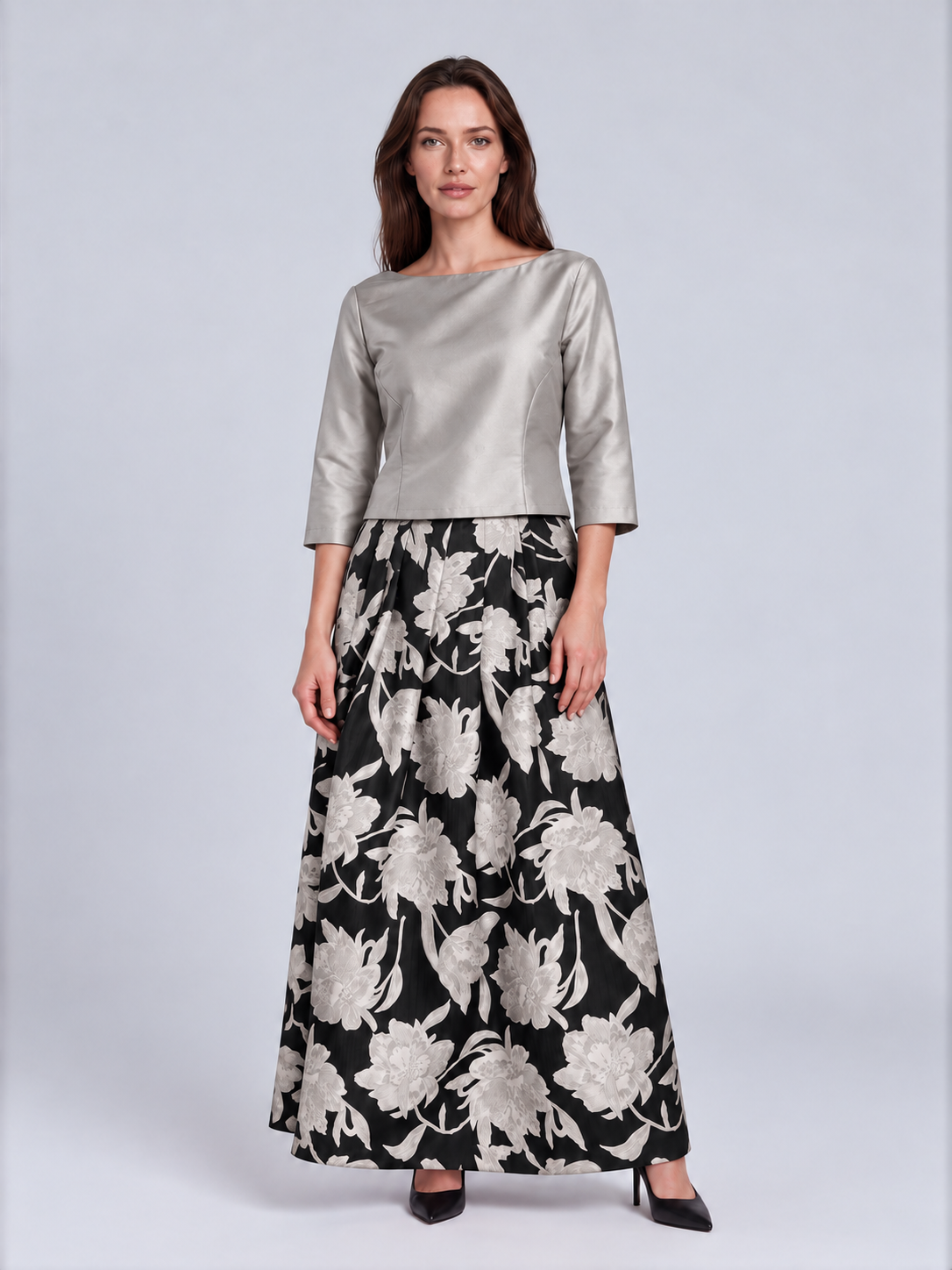 A woman modeling a two-piece outfit consisting of a metallic silver three-quarter sleeve top and a black maxi skirt with a large white floral pattern, Connie Roberson Jennifer Amazon Top