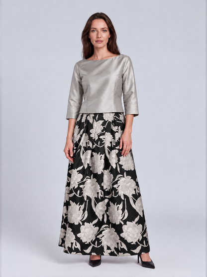 A woman modeling a two-piece outfit consisting of a metallic silver three-quarter sleeve top and a black maxi skirt with a large white floral pattern, Connie Roberson Jennifer Amazon Top