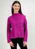 Woman wearing a fuchsia sweater against a plain background