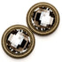 Pair of clothing magnets with gold frames and clear gemstones on a white background