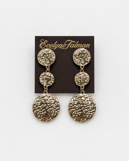 A pair of textured gold-tone drop clip on earrings with three circular discs on each earring, Gold Hammered Triple Drop Clip-on Earring