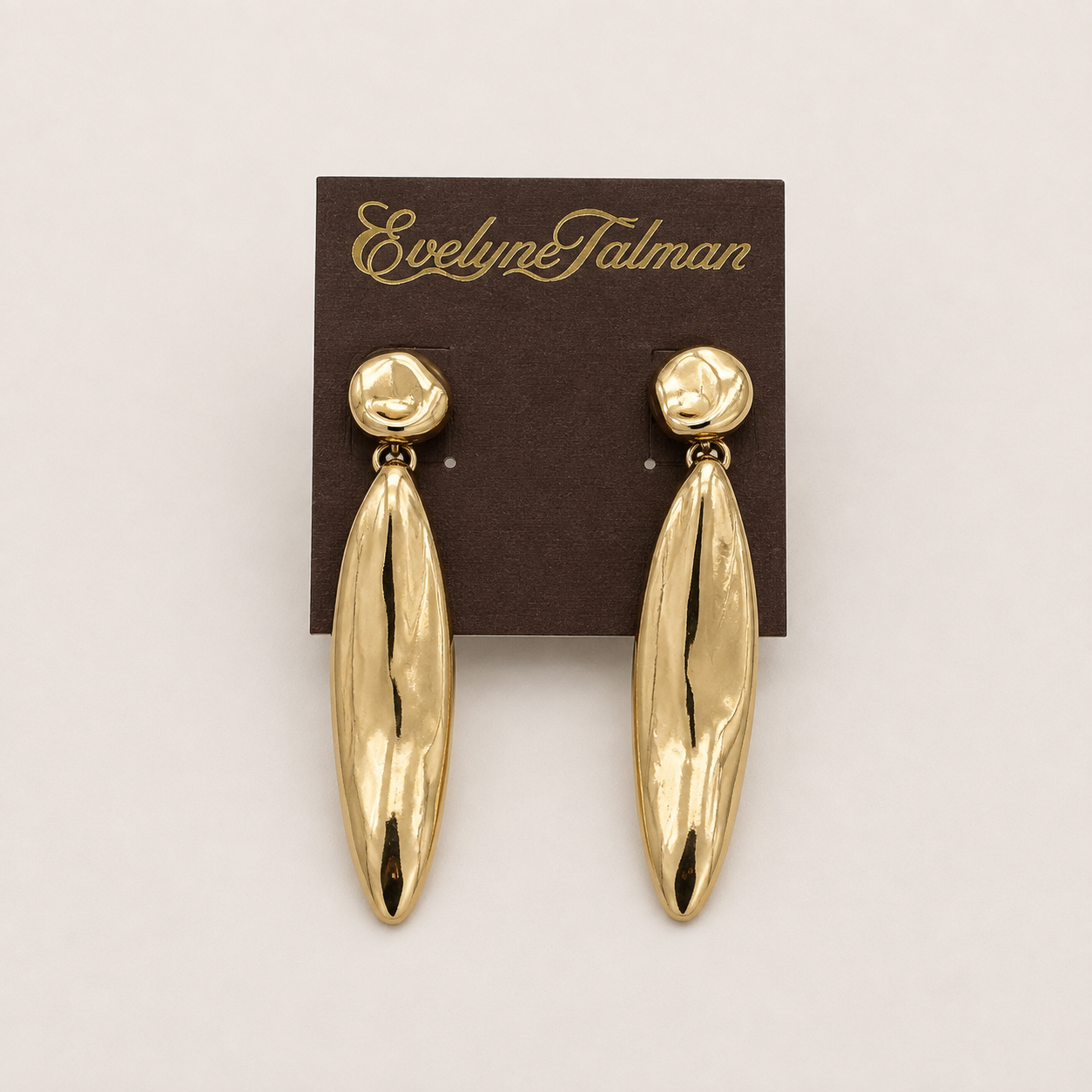 A pair of gold drop earrings with textured teardrop-shaped dangles and round stud top.