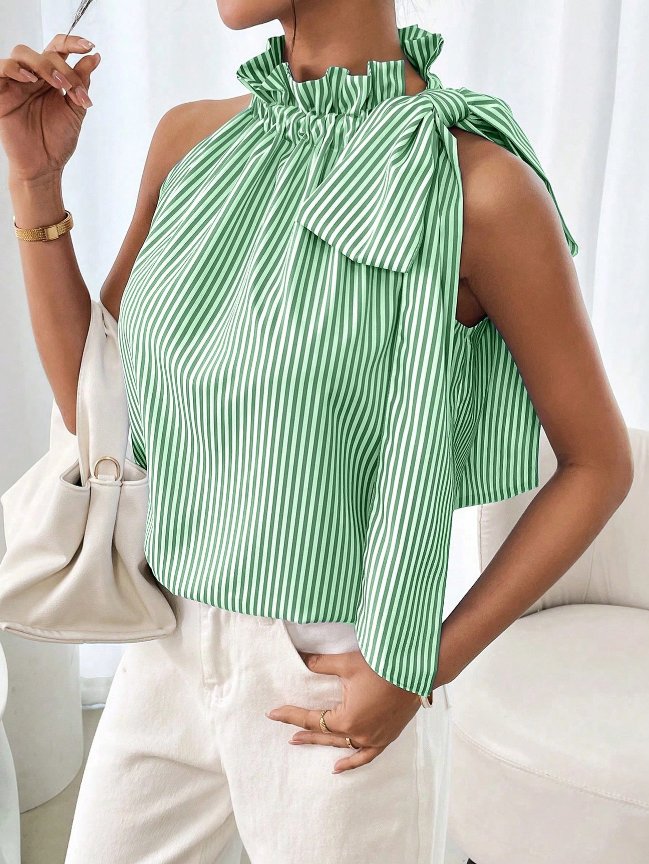 Women’s High-Neck Bow-Tied Sleeveless Shirt green and white striped sleeveless top with a bow detail