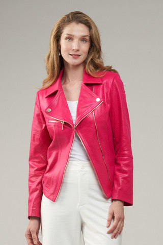 Woman wearing a pink leather jacket against a gray background