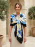 Joseph Ribkoff print scarf with fringe, featuring artistic design and lightweight fabric in a stylish accessory for any outfit.