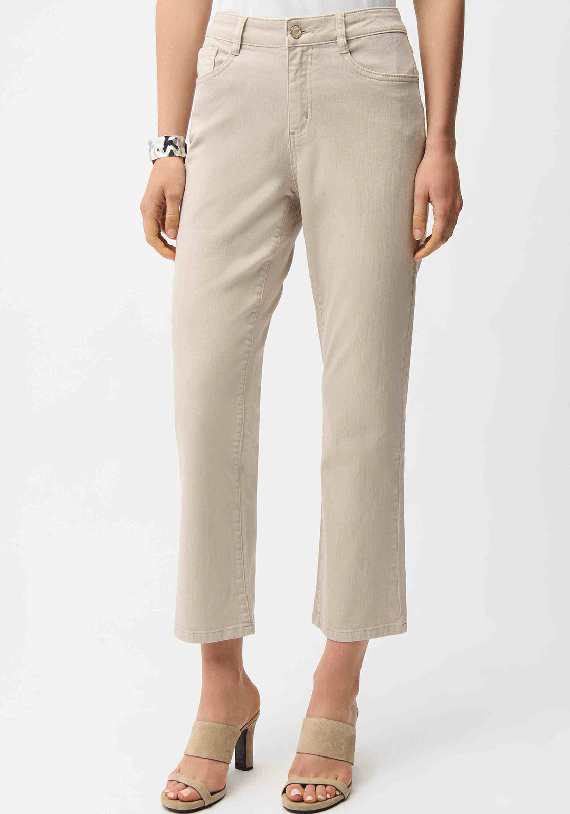Beige Joseph Ribkoff straight-legged jeans with classic fit, shown on a model in a casual setting.