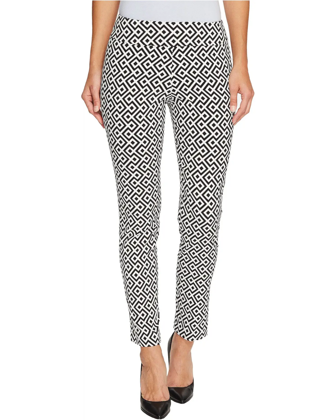 Black and white geometric patterned pants worn by a person on a white background