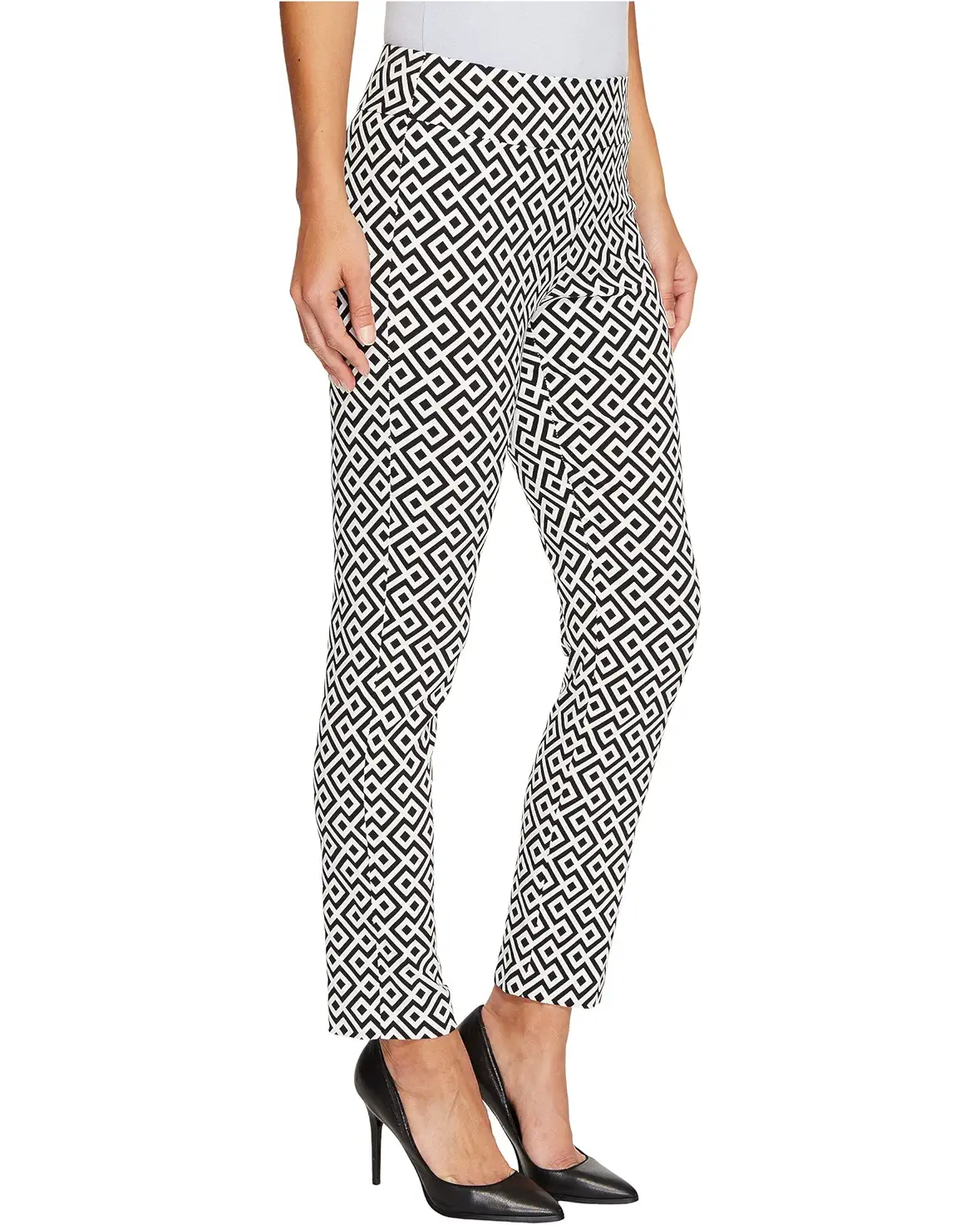 Black and white geometric patterned pants worn by a person on a white background