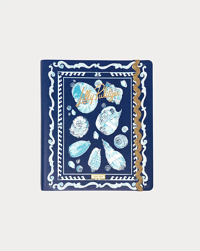 Navy blue Lilly Pulitzer 2026-2027 17 Month Leatherette Agenda with white shell patterns in Resort White Shell Shine