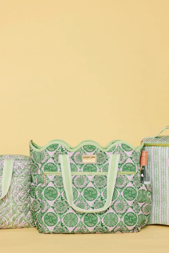 Lilly Pulitzer Scallop Cooler Tote, Tropical Tiles a cooler tote bag with a green and pink floral pattern, featuring light green handles and a matching shoulder strap with white stripes