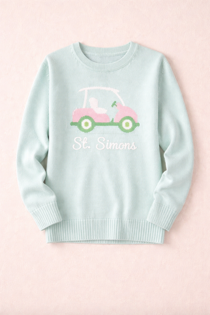 Pink Pineapple St Simons golf cart sweater in pastel colors, featuring a charming golf cart design, perfect for casual wear.