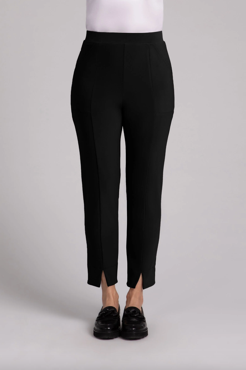 Black Hepburn ankle pants by SYMPLI, featuring a tailored fit and ankle-length design, shown in the product image.