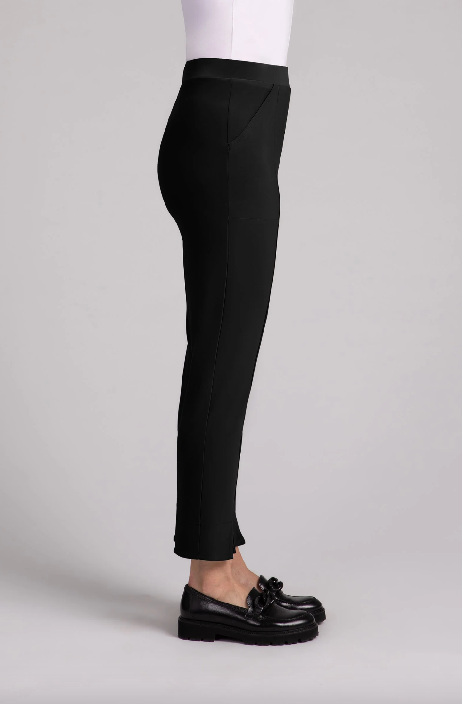 Black Hepburn ankle pants by SYMPLI, showcasing a slim fit design with a tailored waistband and ankle-length silhouette.