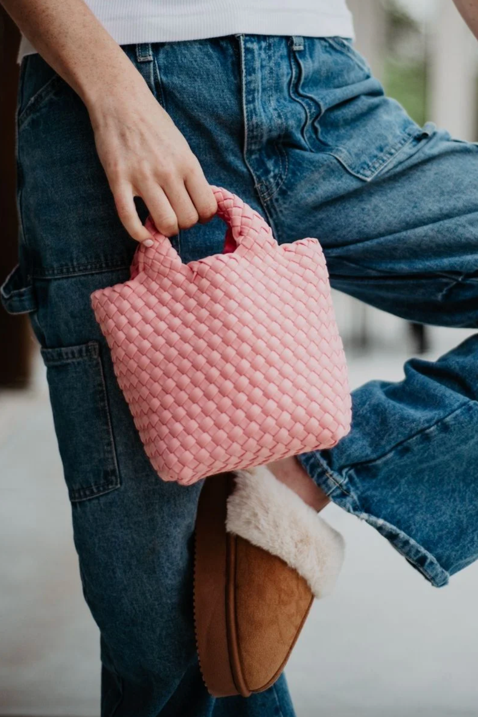 KATYDID neoprene braided clutch handbag with a sleek design, featuring a textured braided exterior and compact size.
