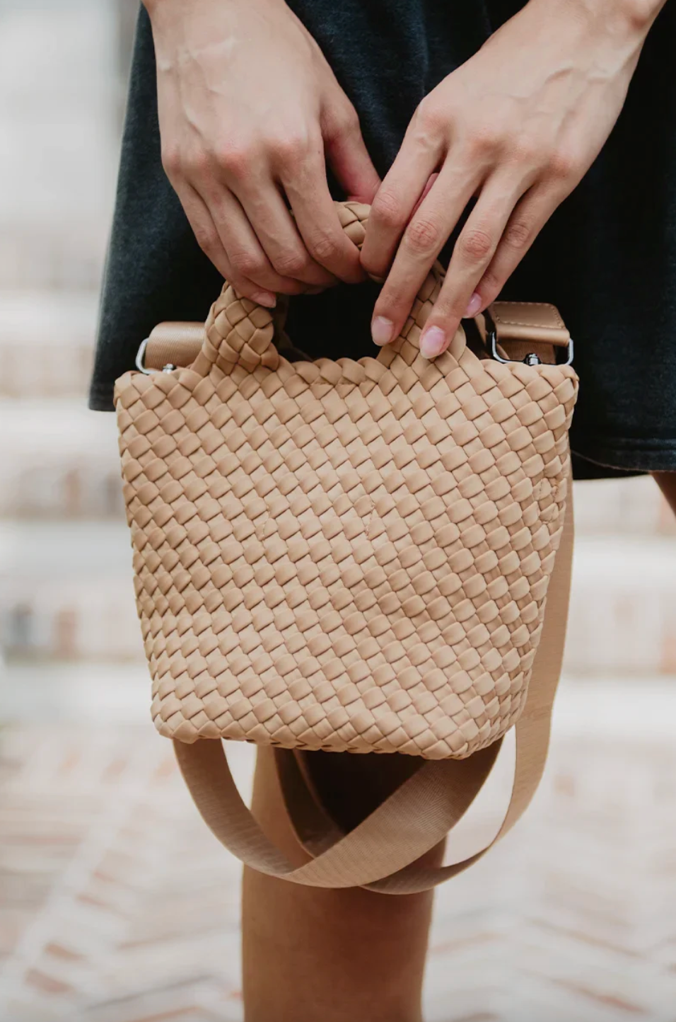 KATYDID neoprene braided clutch bag with sleek design and textured strap, perfect for stylish evening or casual outings.