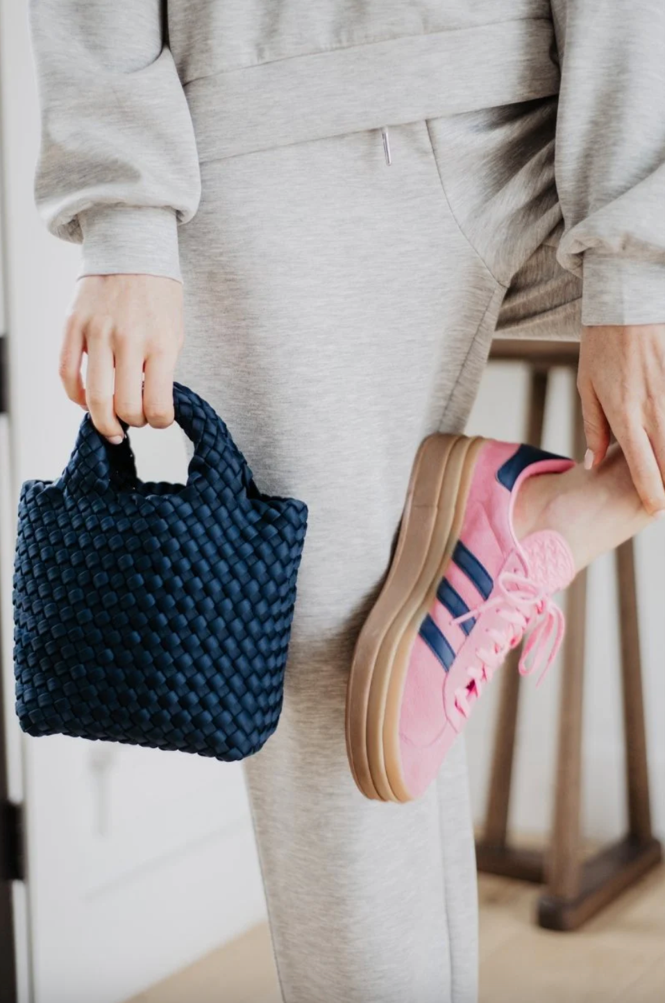 KATYDID neoprene braided clutch handbag with sleek design and zipper closure, perfect for stylish evening or casual outings.