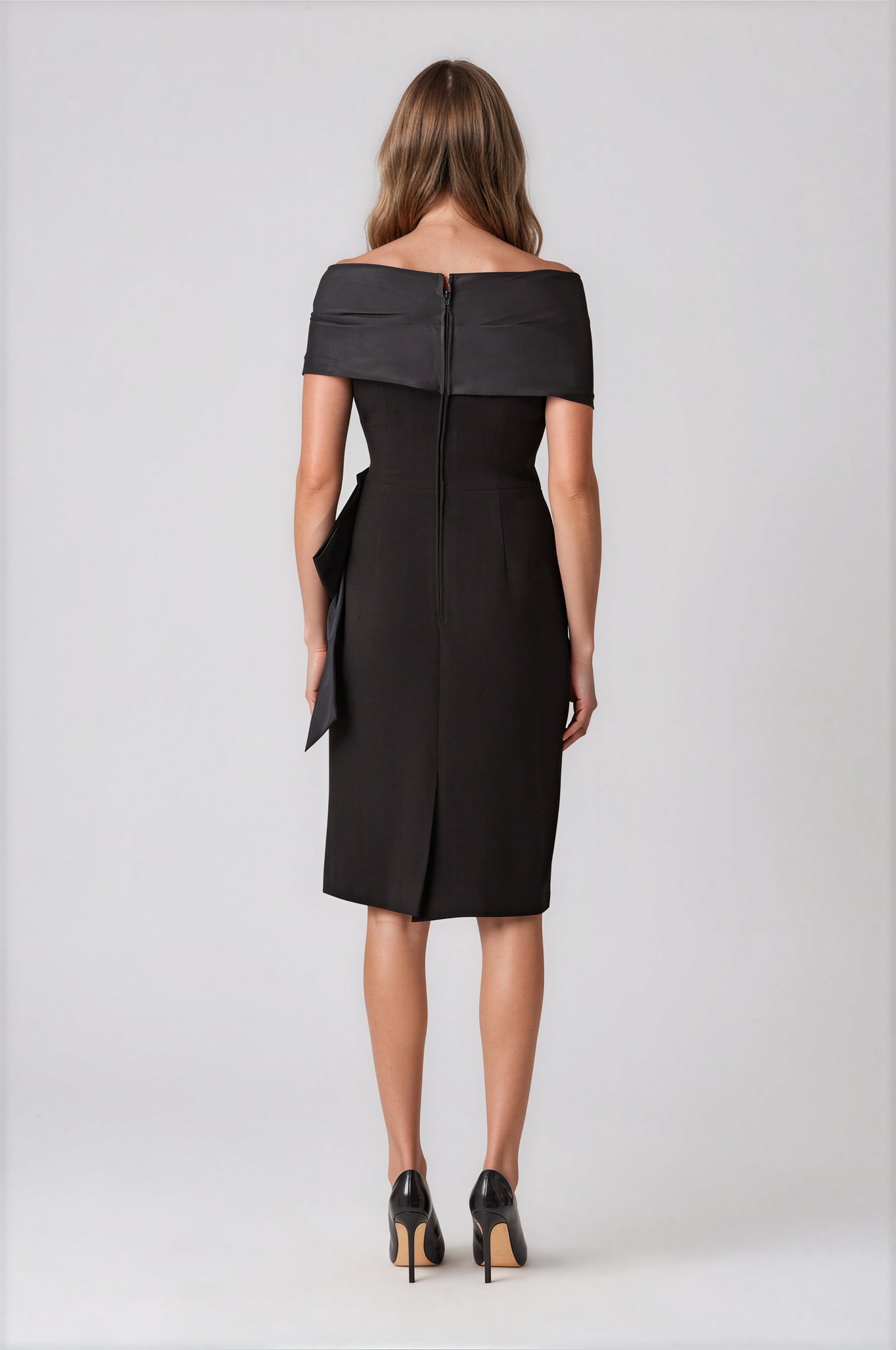 Teri Jon 267226BLK-0 Taffeta and Crepe Bow Sheath Dress black off-the-shoulder midi dress with a large draped waist bow.
