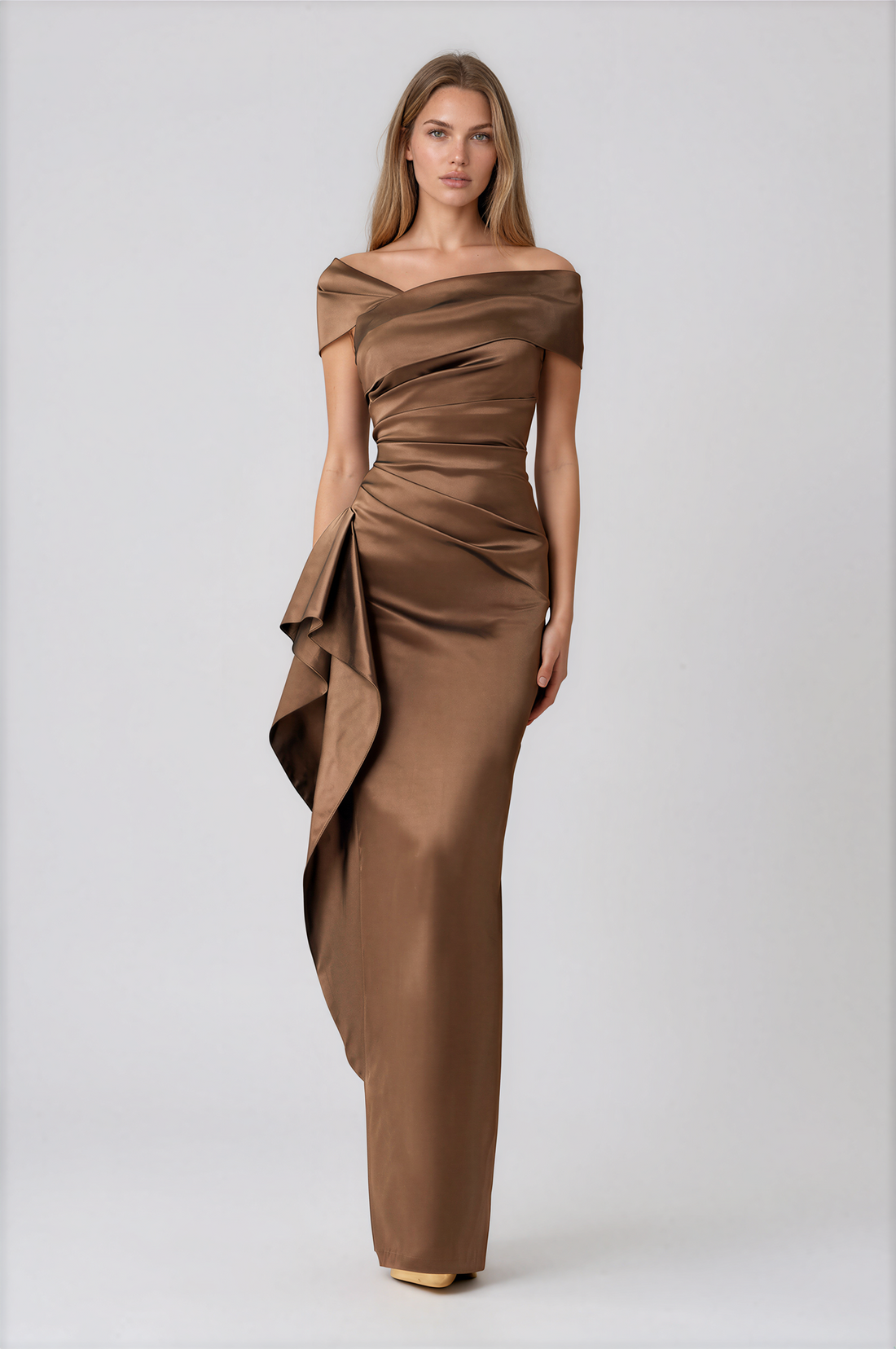 A woman modeling a floor-length off-the-shoulder gown in a warm brown satin fabric by Teri Jon Stretch Taffeta Asymmetrical Off The Shoulder Side Ruffle Gown ITEM 267008BRZ-0