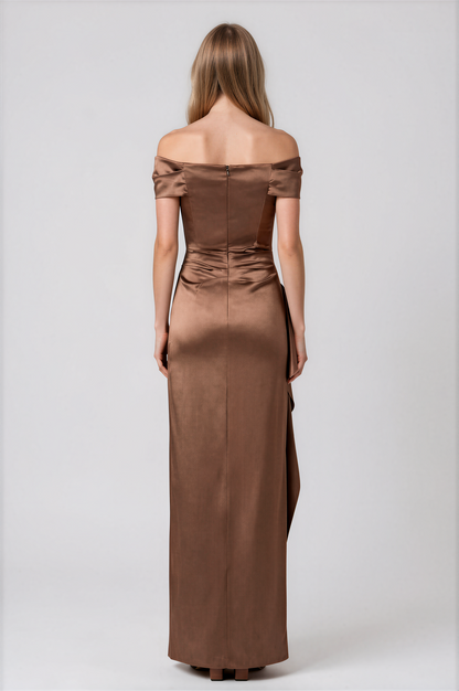 A woman modeling a floor-length off-the-shoulder gown in a warm brown satin fabric by Teri Jon Stretch Taffeta Asymmetrical Off The Shoulder Side Ruffle Gown ITEM 267008BRZ-0